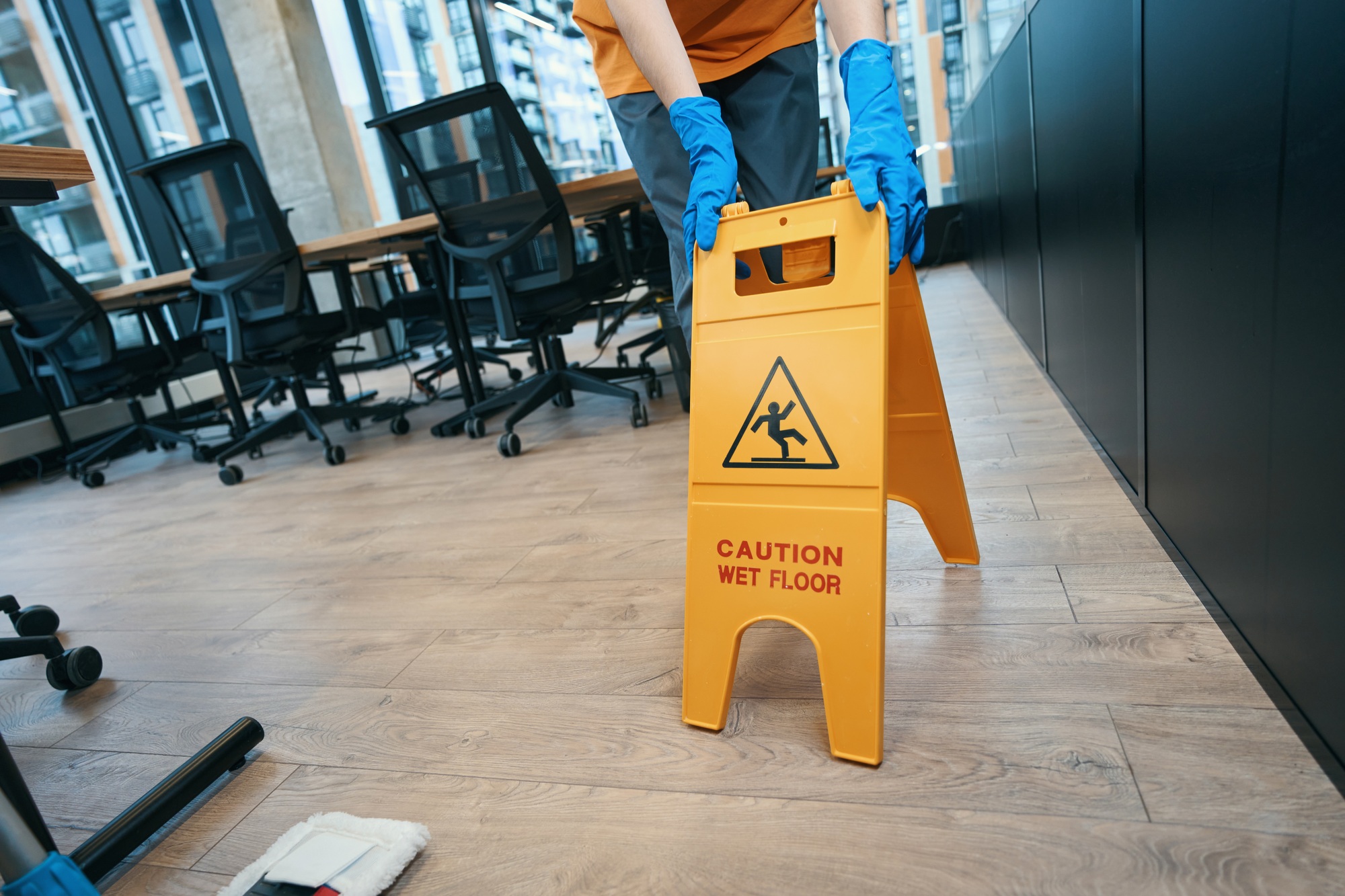 Necessary gadgets for cleaning premises - mop and folding stepladder
